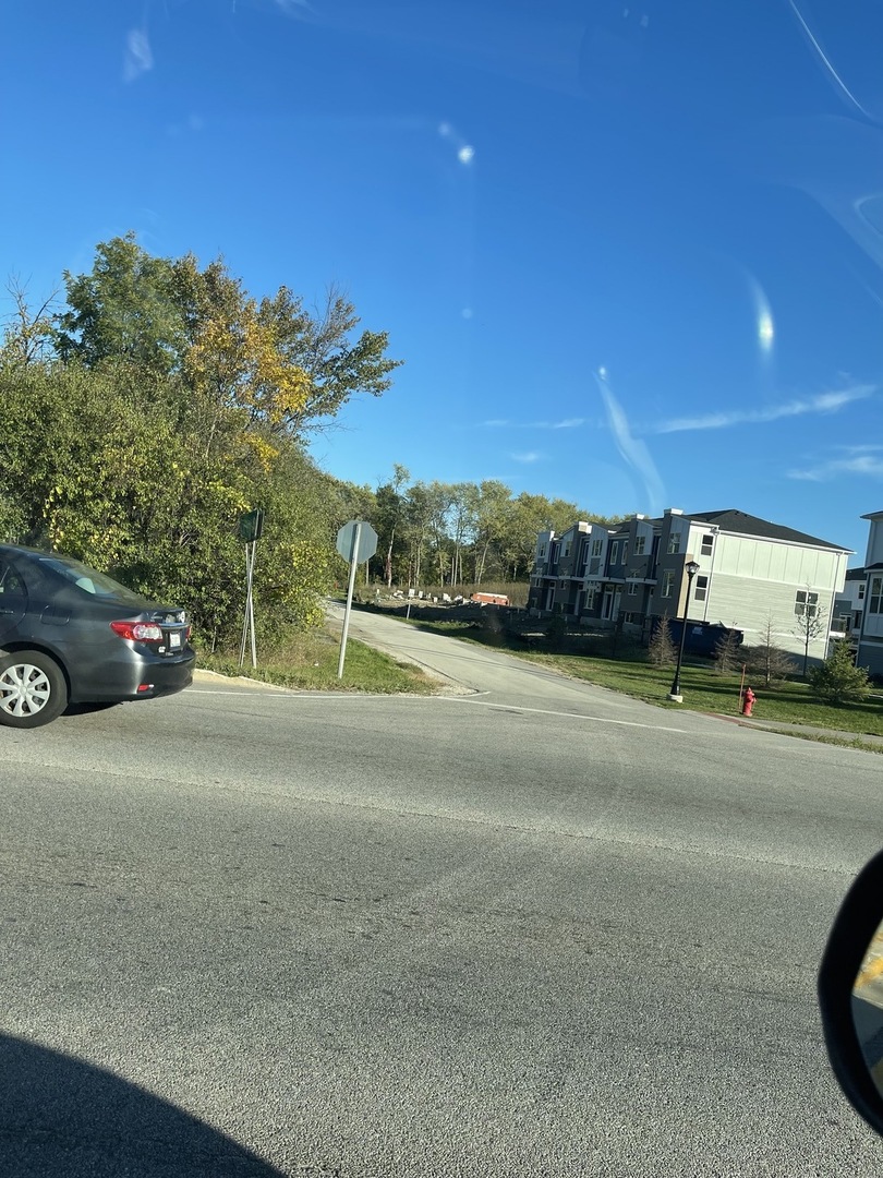 Lot 12-and Rt 59 Warrenville, IL 60555 - Photo 2 of 2 a view of street with parked cars