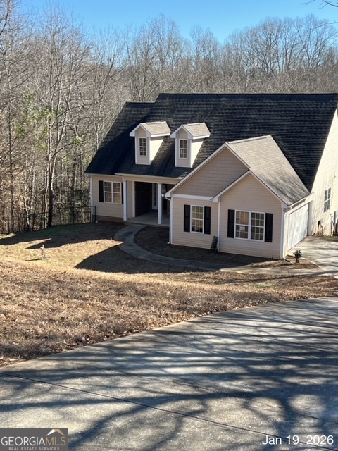 a front view of a house with a yard
