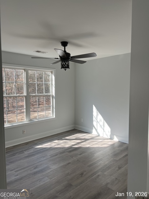522 Anniston Drive Athens, GA 30607 - Photo 8 of 19 a view of an empty room with wooden floor and a window