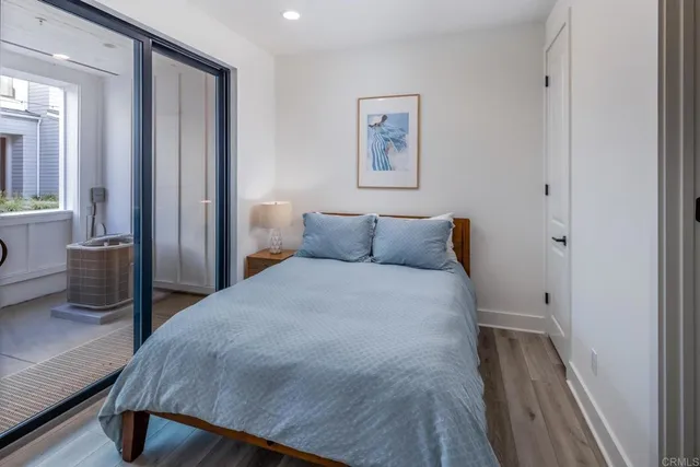 a bedroom with a bed and a view of bathroom