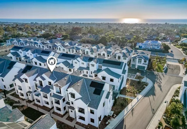 an aerial view of a house with a city view