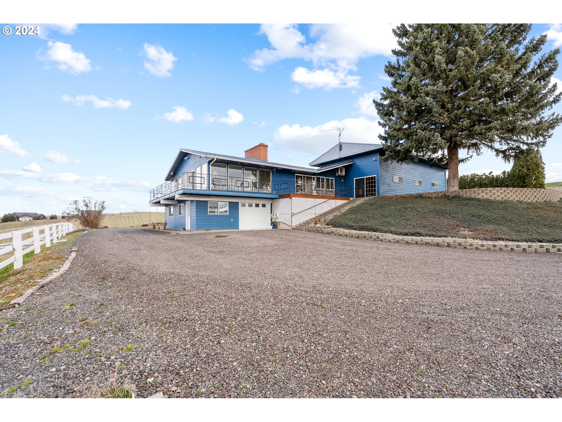 69748 Shaw Road Pendleton, OR 97801 - Photo 2 of 48 a view of a house with a yard