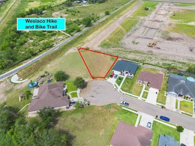 a view of a swimming pool with a yard