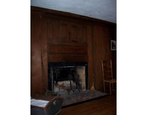 20 Kelsey Road Boxford, MA 01921 - Photo 8 of 8 a living room with a chair and a fireplace