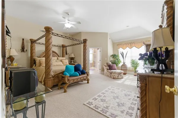 a view of a livingroom with furniture and a flat screen tv