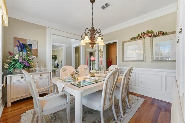 a view of a dining room with furniture and window