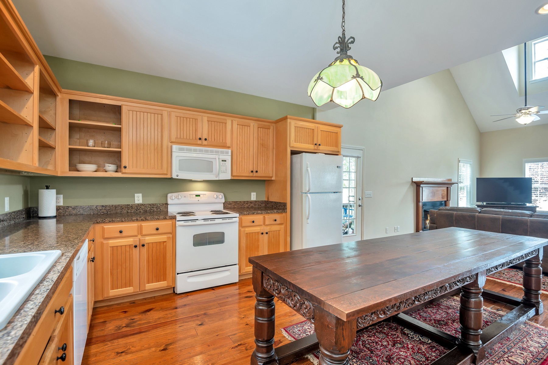 4949 Homer Worsham Road Springfield, TN 37172 - Photo 19 of 33 a kitchen with stainless steel appliances granite countertop a stove refrigerator and a view of living room