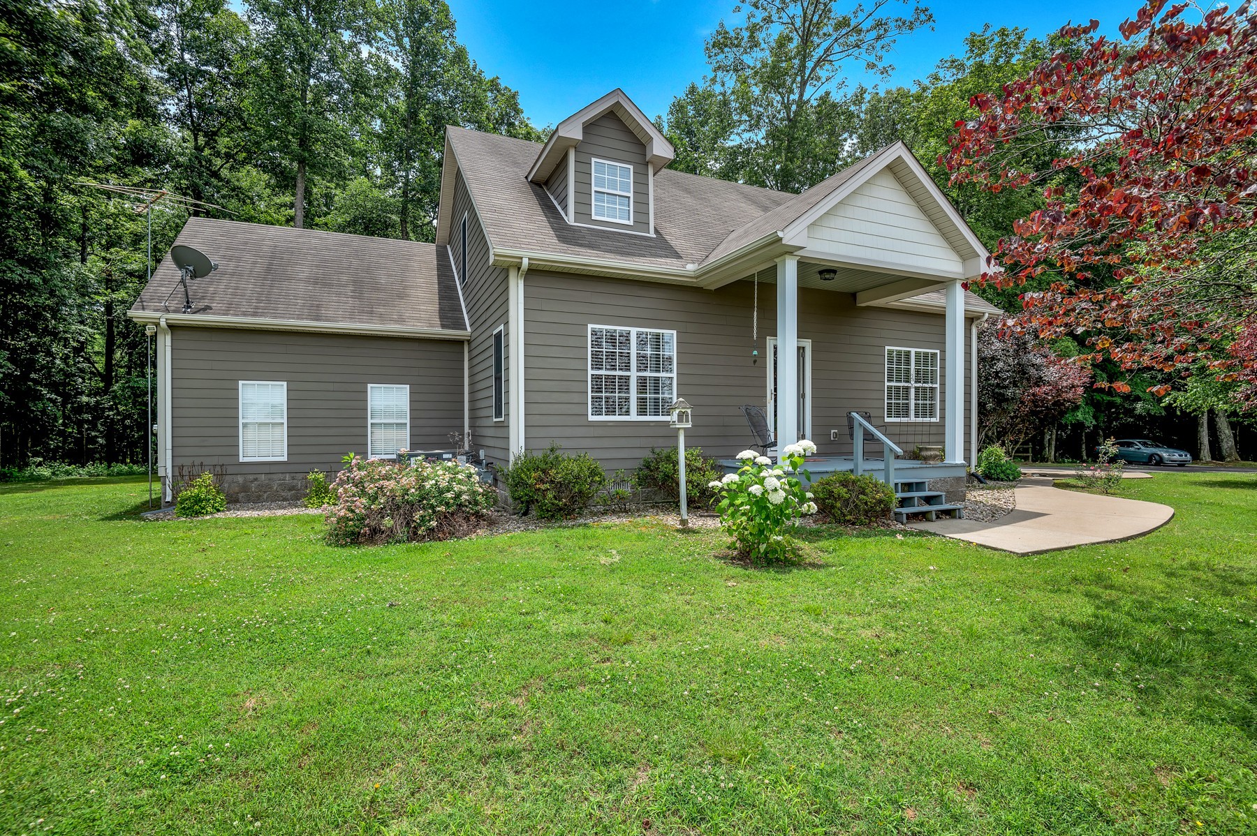 4949 Homer Worsham Road Springfield, TN 37172 - Photo 9 of 33 a front view of a house with garden