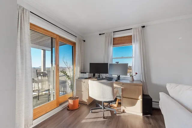 a workspace with furniture and wooden floor