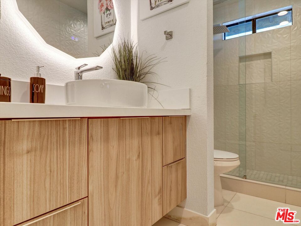 1920 North San Gorgonio Road Palm Springs, CA 92262 - Photo 17 of 23 a bathroom with a sink and mirror