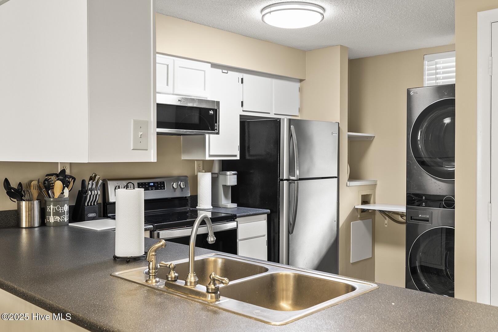 1505 Salter Path Road, Unit 328 Indian Beach, NC 28512 - Photo 5 of 26 In kitchen laundry