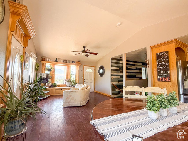 425 East Mule Deer Road Central, UT 84722 - Photo 8 of 72 Living room with vaulted ceiling, dark wood-style floors, a ceiling fan, and baseboards