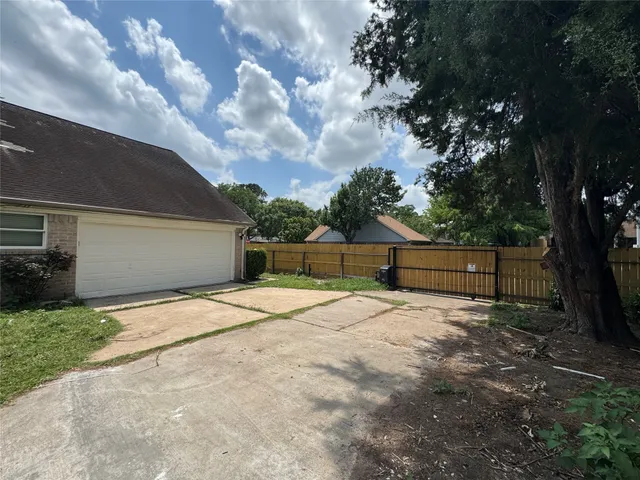 a backyard of a house with lots of green space