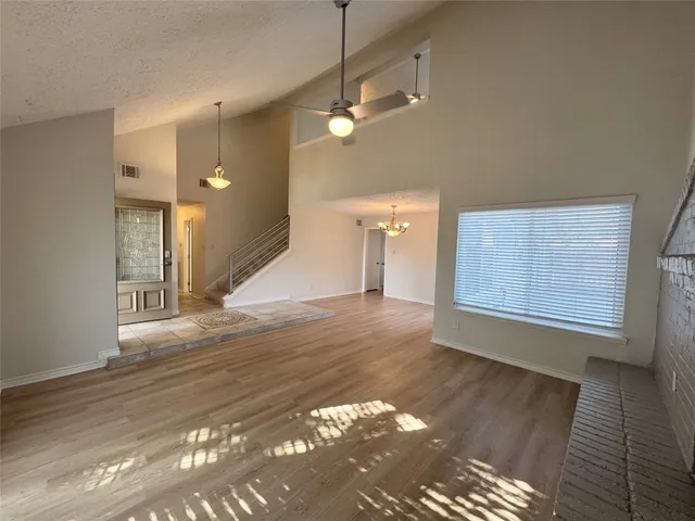 a view of a room with window and wooden floor