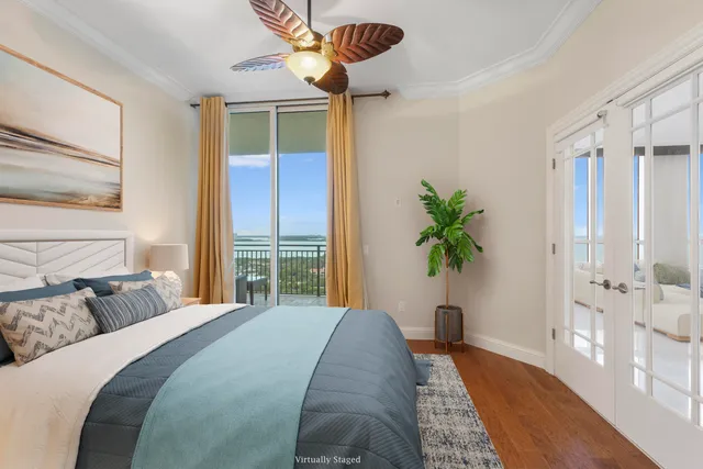 a large kitchen with kitchen island a sink stainless steel appliances and a chandelier