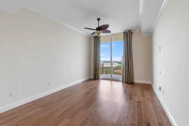 a very nice looking living room with a large window and furniture