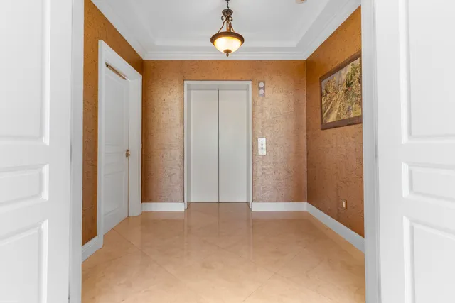 a view of a lake with boats and trees in front of it