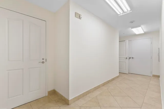 a view of outdoor space with a garden and signage