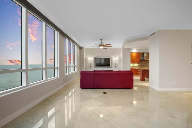 a kitchen with stainless steel appliances granite countertop a sink and a refrigerator