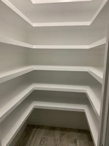 a view of an empty walk in closet