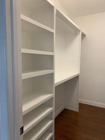 a view of an empty walk in closet