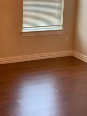 a view of a room that has a window in it