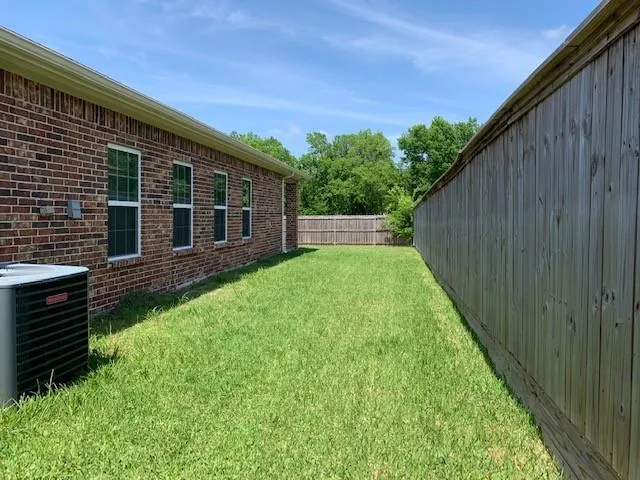a view of a backyard with plants