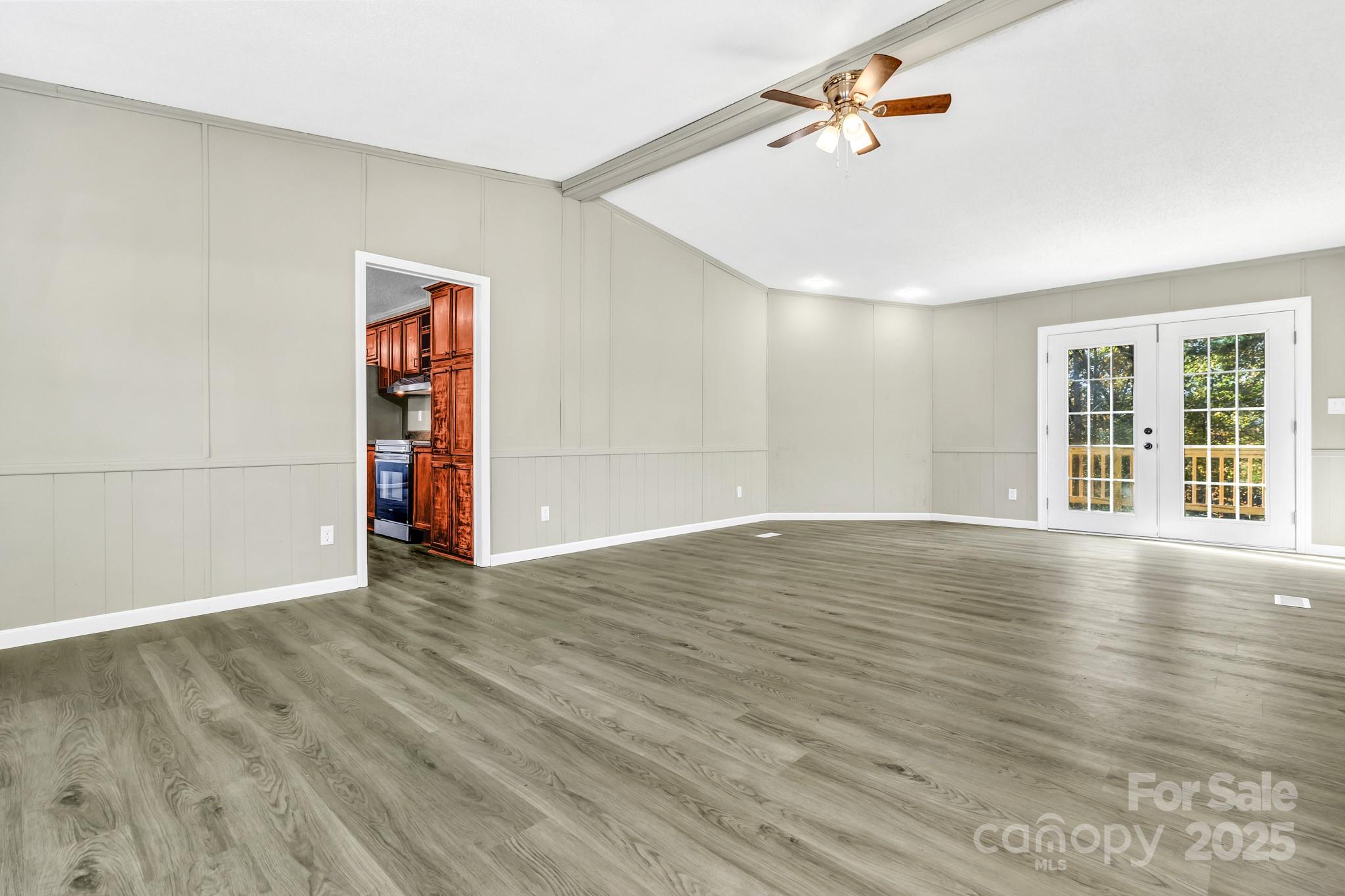 80 Winter Lane, Unit 8&11 Mill Spring, NC 28756 - Photo 12 of 41 wooden floor in an empty room with a window