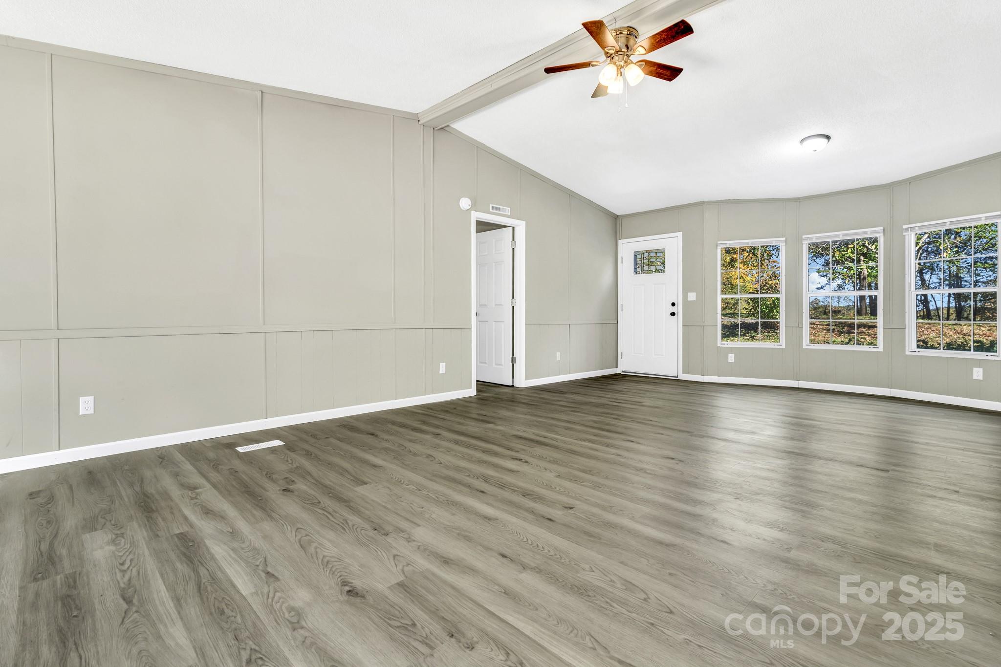 80 Winter Lane, Unit 8&11 Mill Spring, NC 28756 - Photo 13 of 41 wooden floor in an empty room with a window