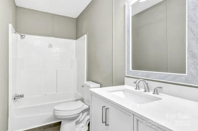 a bathroom with a sink toilet tub and shower
