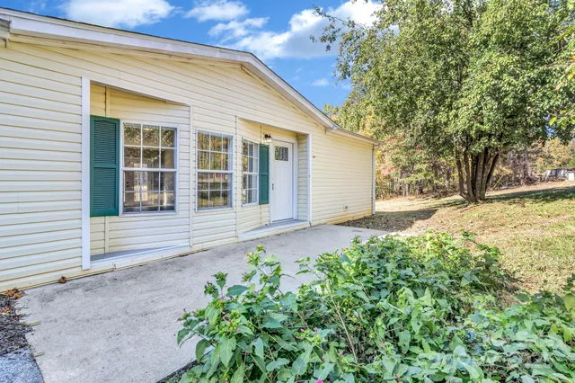 a house with trees in the background