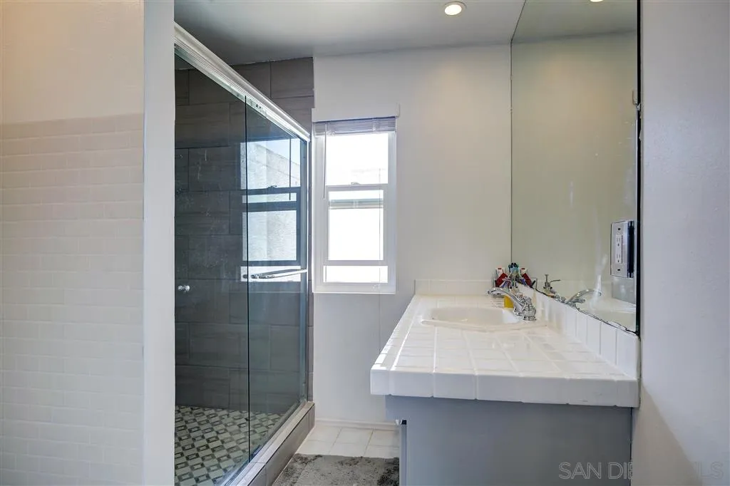 14558 Fruitvale Road Valley Center, CA 92082 - Photo 13 of 24 a bathroom with a sink and a shower