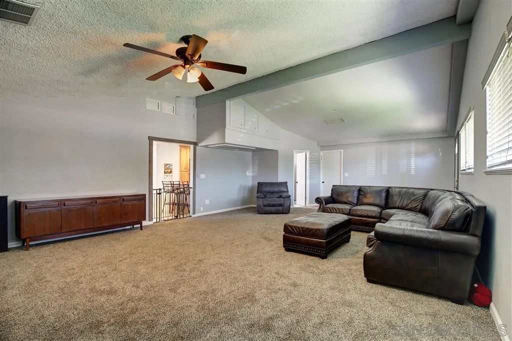 14558 Fruitvale Road Valley Center, CA 92082 - Photo 15 of 24 a living room with furniture and a ceiling fan