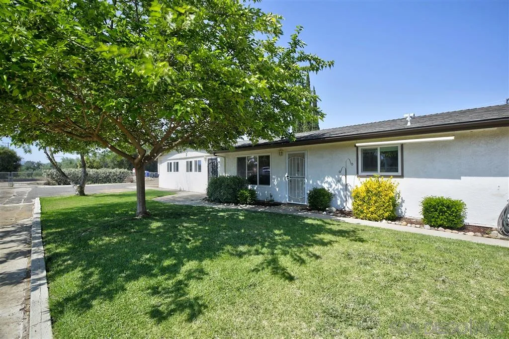 14558 Fruitvale Road Valley Center, CA 92082 - Photo 2 of 24 a view of a house with a yard