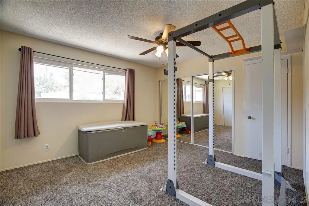 14558 Fruitvale Road Valley Center, CA 92082 - Photo 21 of 24 a view of room with window and a ceiling fan