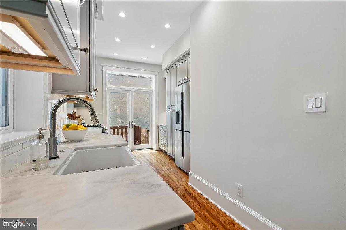1105 G Street Southeast Washington, DC 20003 - Photo 22 of 51 Marble counters and farmhouse sink.
