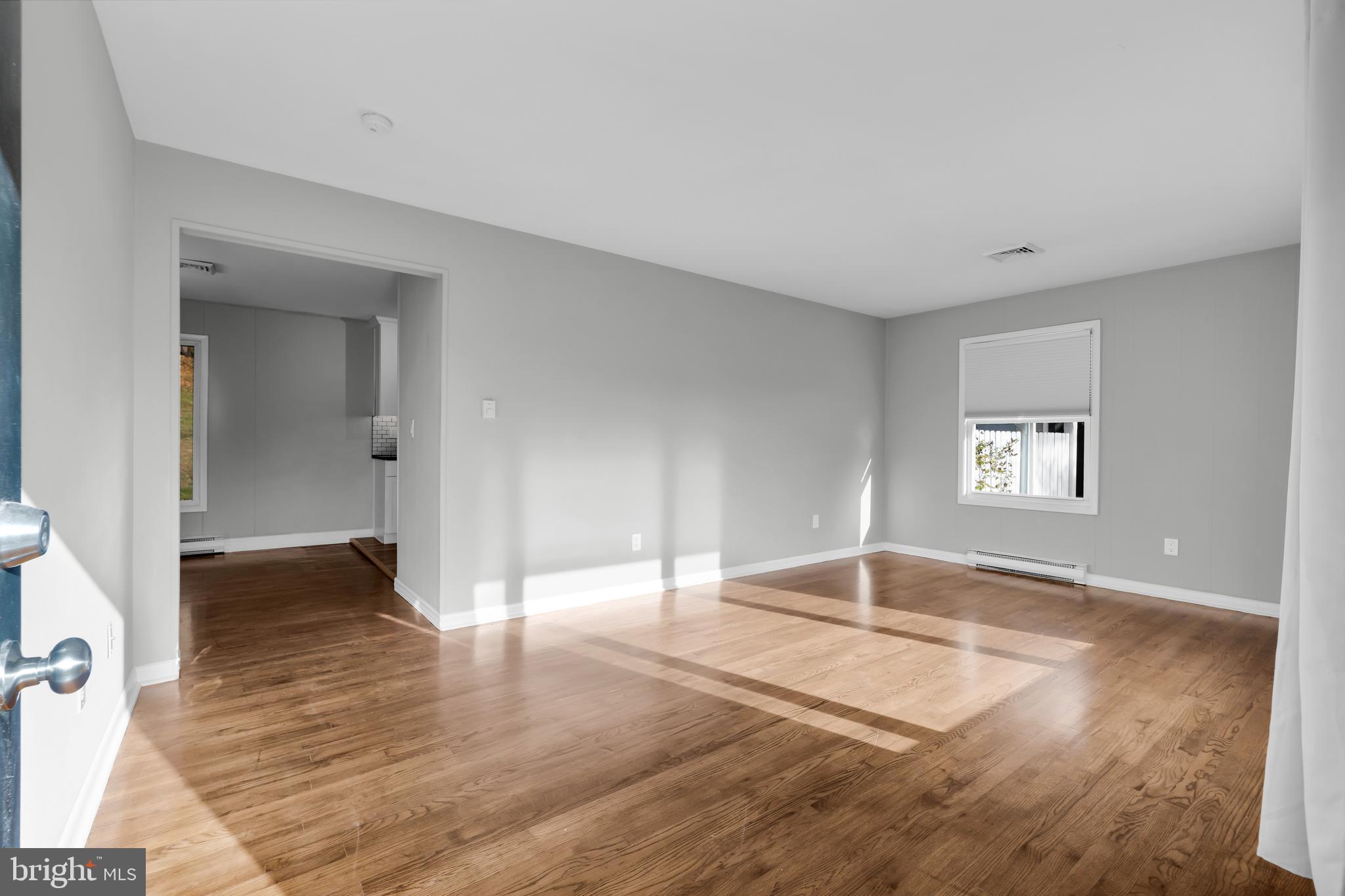 8979 Easton Road Ottsville, PA 18942 - Photo 12 of 39 a view of empty room with wooden floor