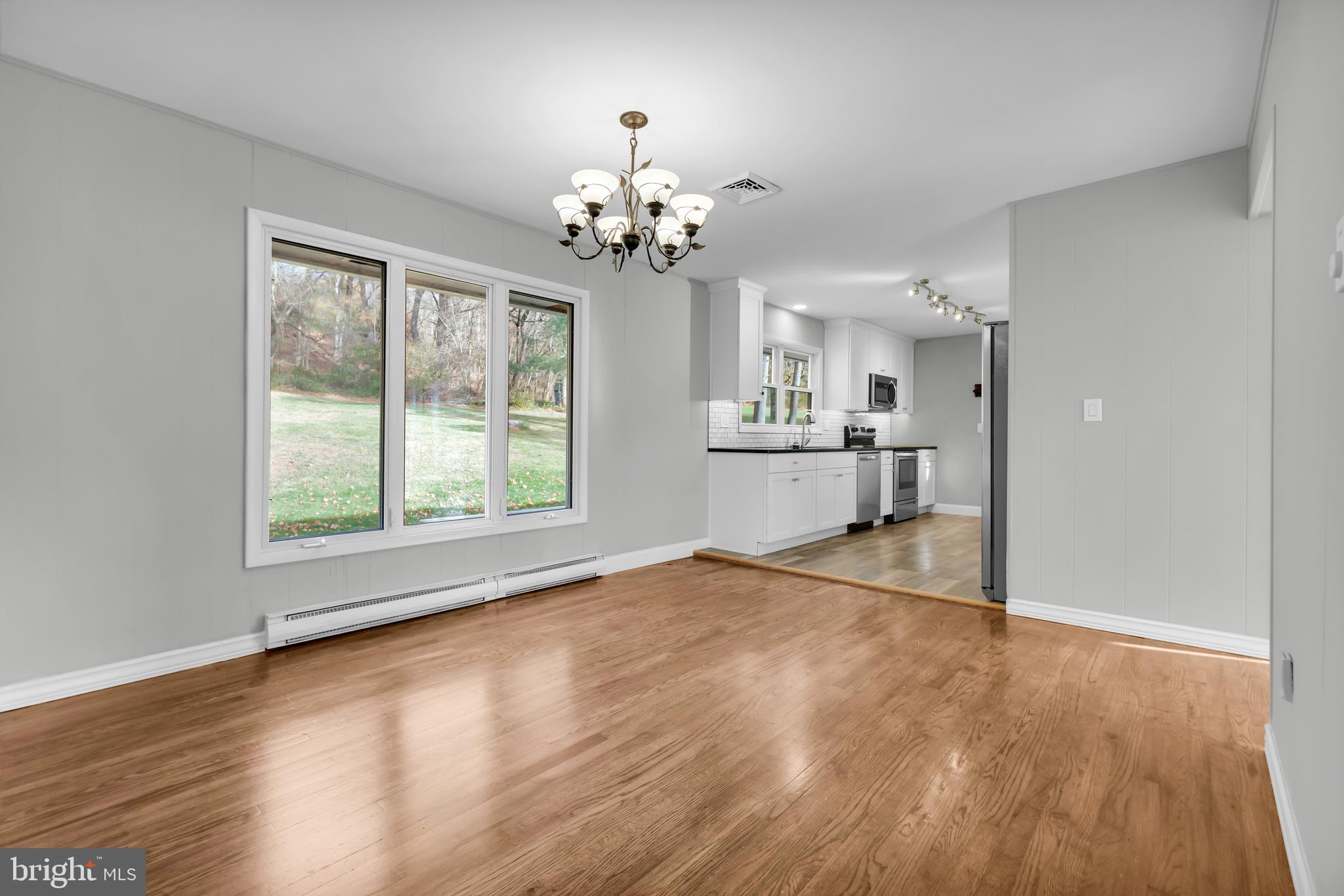 8979 Easton Road Ottsville, PA 18942 - Photo 13 of 39 a view of an empty room with kitchen and window