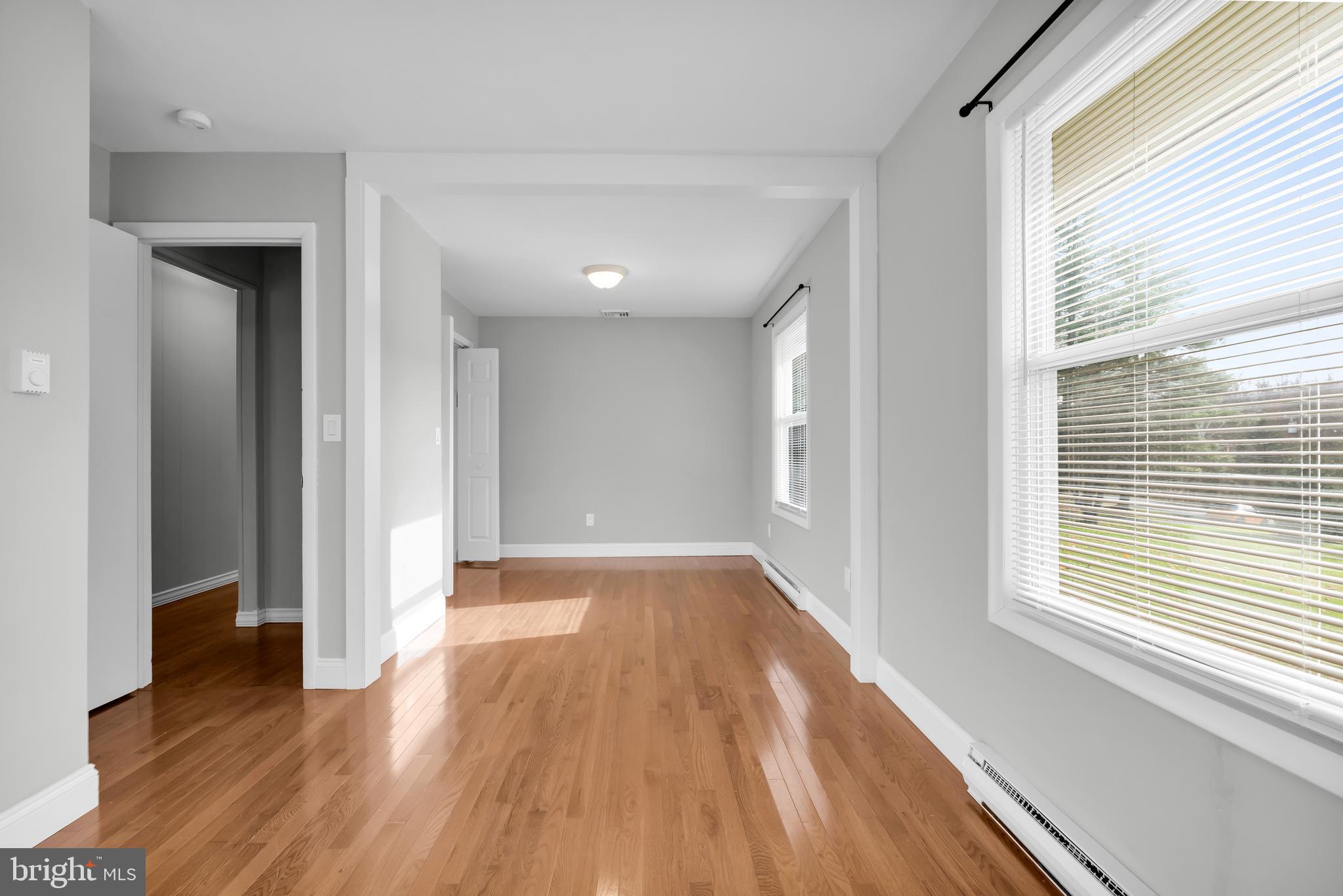 8979 Easton Road Ottsville, PA 18942 - Photo 15 of 39 a view of an empty room with wooden floor and a window