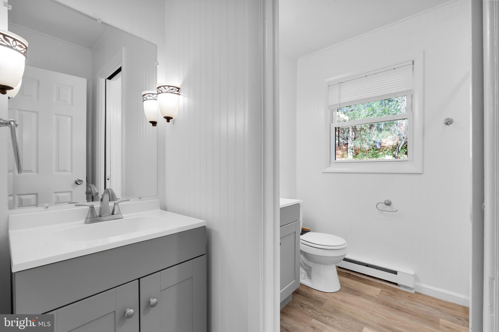8979 Easton Road Ottsville, PA 18942 - Photo 21 of 39 a bathroom with a sink toilet and a mirror