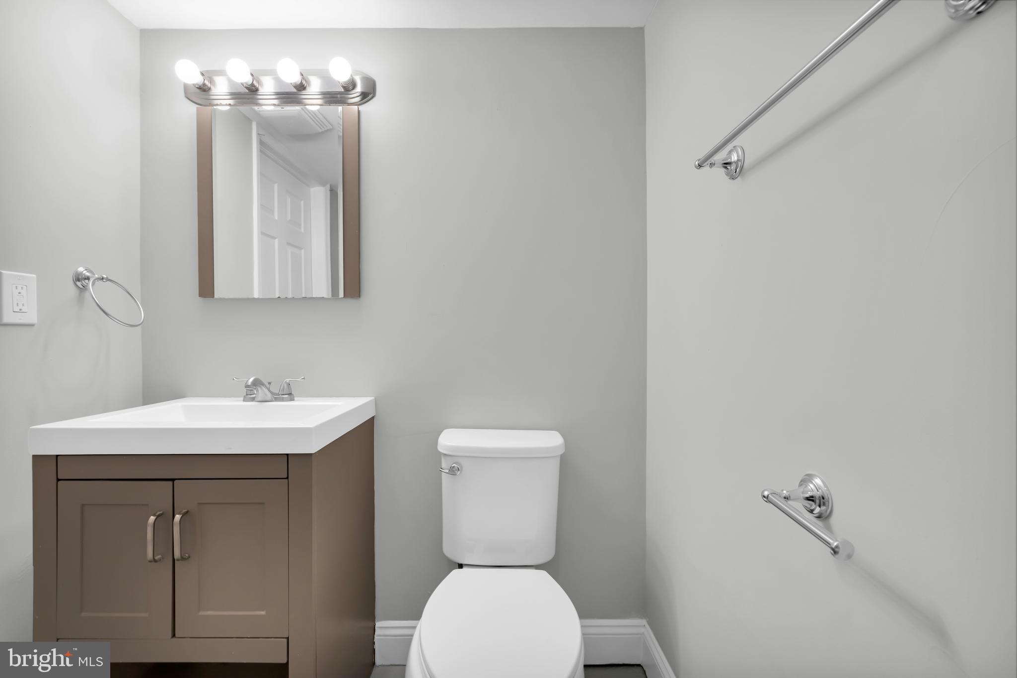 8979 Easton Road Ottsville, PA 18942 - Photo 29 of 39 a bathroom with a toilet sink and mirror