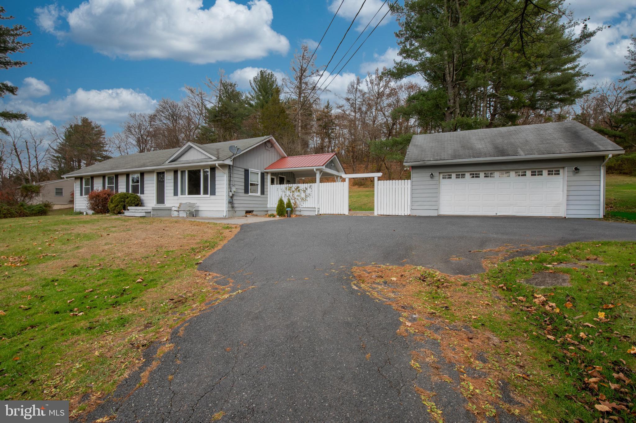 8979 Easton Road Ottsville, PA 18942 - Photo 3 of 39 front view of a house with a yard