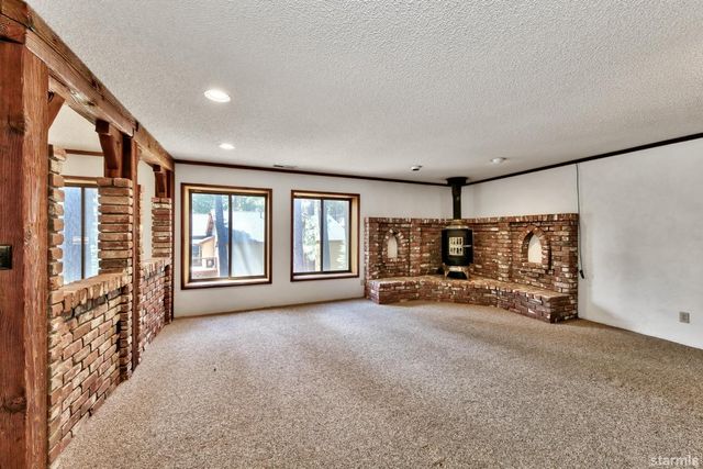 a view of livingroom with furniture and a large window