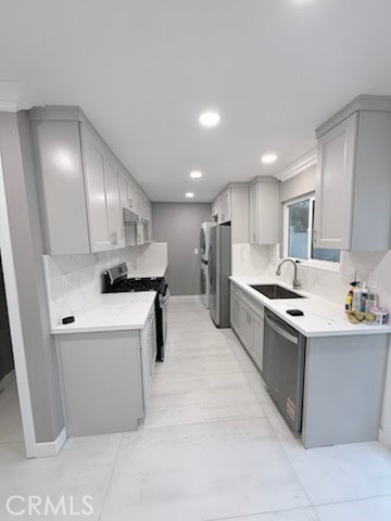 16586 Montego Way Tustin, CA 92780 - Photo 1 of 17 a kitchen with stainless steel appliances kitchen island granite countertop a sink and a refrigerator