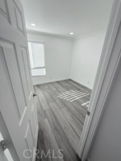 16586 Montego Way Tustin, CA 92780 - Photo 11 of 17 a view of wooden floor and windows in a room