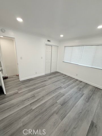 16586 Montego Way Tustin, CA 92780 - Photo 12 of 17 an empty room with wooden floor