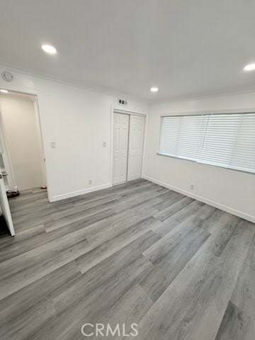 16586 Montego Way Tustin, CA 92780 - Photo 13 of 17 an empty room with wooden floor
