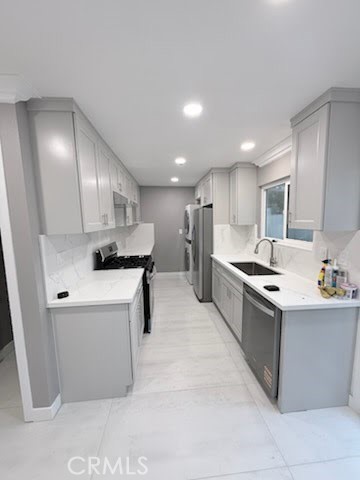 16586 Montego Way Tustin, CA 92780 - Photo 4 of 17 a kitchen with stainless steel appliances kitchen island granite countertop a sink and a refrigerator