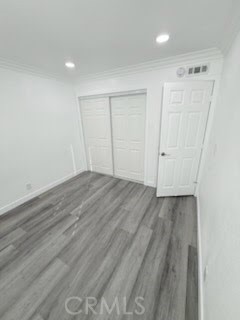 16586 Montego Way Tustin, CA 92780 - Photo 9 of 17 an empty room with wooden floor