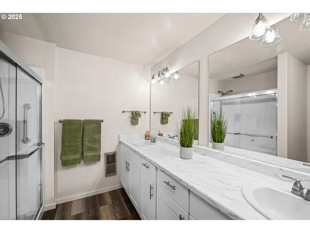 a bathroom with a shower and a mirror